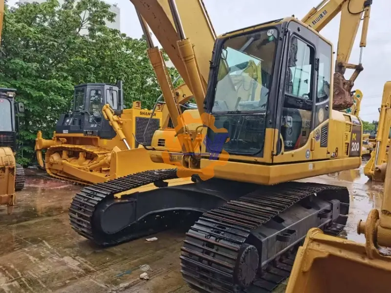 A versatile Komatsu PC200-8 20-ton excavator equipped with a quick coupler for fast attachment changes.